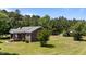 A delightful side view of a brick home situated on a lush green lawn at 1131 Pulley Gordon Rd, Zebulon, NC 27597