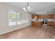 Bright eat-in kitchen with tile flooring, oak cabinets and large windows overlooking the backyard at 1131 Pulley Gordon Rd, Zebulon, NC 27597