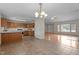Spacious kitchen features wood cabinets, tile flooring, and a large island with seating at 1131 Pulley Gordon Rd, Zebulon, NC 27597