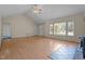 Open living area with hardwood floors, a fireplace, and a view of the front yard at 1131 Pulley Gordon Rd, Zebulon, NC 27597
