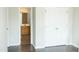 Comfortable bedroom featuring neutral walls, laminate flooring and ensuite bathroom access at 12 Linsey Ct, Lillington, NC 27546