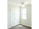 Bright bedroom featuring laminate flooring, a ceiling fan, and a closet for easy storage at 12 Linsey Ct, Lillington, NC 27546