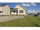 Charming single-Gathering home boasts a welcoming front porch and ample parking on a well-manicured lawn at 12 Linsey Ct, Lillington, NC 27546