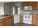 Well-equipped kitchen featuring stainless steel appliances, light wood cabinets, and durable countertops at 12 Linsey Ct, Lillington, NC 27546
