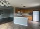 Open concept kitchen with modern appliances, ample counter space, a kitchen island, and great natural light at 12 Linsey Ct, Lillington, NC 27546
