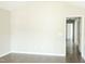 Spacious living room with neutral paint, modern laminate flooring, and view to a hallway at 12 Linsey Ct, Lillington, NC 27546
