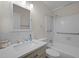 Bright bathroom with a tub shower combo, updated fixtures and modern vanity at 1208 W Murray Ave, Durham, NC 27704