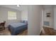Comfortable bedroom features natural light, a desk and laminate flooring at 1208 W Murray Ave, Durham, NC 27704
