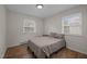 This bedroom is bright and features a neutral color scheme and laminate flooring at 1208 W Murray Ave, Durham, NC 27704