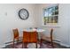 Bright dining area features a modern table and chairs, a large window with natural light, and stylish decor at 1208 W Murray Ave, Durham, NC 27704