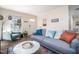 Inviting living room featuring a comfortable sofa, colorful decor, and ample natural light for a relaxing atmosphere at 1208 W Murray Ave, Durham, NC 27704