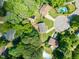 Aerial view of neighborhood and cul-de-sac featuring mature landscaping at 1220 Sherbrooke Ct, Raleigh, NC 27612