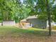 Spacious backyard featuring a wooden deck, shed and landscaped lawn at 1220 Sherbrooke Ct, Raleigh, NC 27612