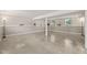 Spacious basement area with concrete floors and natural light from two windows at 1220 Sherbrooke Ct, Raleigh, NC 27612