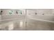 Large basement area with concrete floors and natural light from the windows at 1220 Sherbrooke Ct, Raleigh, NC 27612