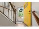 View of the front door opening into an entryway with stairs and wood floors at 1220 Sherbrooke Ct, Raleigh, NC 27612
