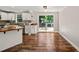 Dining area with hardwood floors and access to the backyard deck through glass doors at 1220 Sherbrooke Ct, Raleigh, NC 27612