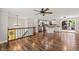 View of kitchen appliances, kitchen island, and hardwood floors from the upstairs living area at 1220 Sherbrooke Ct, Raleigh, NC 27612