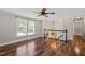Upstairs living area with hardwood floors, natural light, and an overhead fan at 1220 Sherbrooke Ct, Raleigh, NC 27612