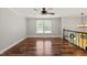 Open concept living area with hardwood floors and bright windows at 1220 Sherbrooke Ct, Raleigh, NC 27612