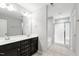 Bathroom with double sink vanity, large mirror, tiled floors and shower-tub combination at 1231 Silver Beach Way, Raleigh, NC 27606