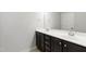 Bathroom with double sink vanity, granite countertop, and dark wood cabinets offers storage space at 1231 Silver Beach Way, Raleigh, NC 27606