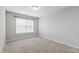 Comfortable bedroom with carpet floors and a large window, providing natural light at 1231 Silver Beach Way, Raleigh, NC 27606