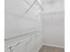 Walk-in closet featuring neutral carpet, white walls and wire shelving at 1231 Silver Beach Way, Raleigh, NC 27606