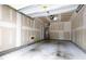 Unfinished garage space with concrete floor and visible utilities at 1231 Silver Beach Way, Raleigh, NC 27606