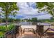 Scenic view of community lake from staircase with fountain at 1231 Silver Beach Way, Raleigh, NC 27606