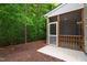 Cozy screened-in porch with a concrete floor, white trim, and a view of the wooded backyard at 1231 Silver Beach Way, Raleigh, NC 27606