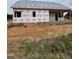 Exterior view of new home construction in progress with brick base and siding installation at 1301 Parkertown Rd, Four Oaks, NC 27524