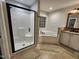 Bright bathroom features a glass shower and jacuzzi tub at 1309 Bartlett Cir, Hillsborough, NC 27278