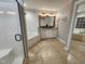 Bright bathroom features a glass shower, tub and double sink vanity at 1309 Bartlett Cir, Hillsborough, NC 27278