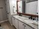 Renovated bathroom with double sink vanity and granite countertop at 1309 Bartlett Cir, Hillsborough, NC 27278