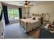 Bright bedroom features a fan, natural light and hardwood floors at 1309 Bartlett Cir, Hillsborough, NC 27278