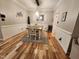 Cozy dining room features hardwood floors, neutral paint and wainscoting at 1309 Bartlett Cir, Hillsborough, NC 27278