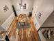 View from above of the dining room with seating for six, hardwood flooring, and modern fixtures at 1309 Bartlett Cir, Hillsborough, NC 27278