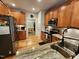 Well-equipped kitchen with stainless steel appliances, wood cabinets, and granite countertops at 1309 Bartlett Cir, Hillsborough, NC 27278