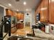Well-equipped kitchen with stainless steel appliances, wood cabinets, and granite countertops at 1309 Bartlett Cir, Hillsborough, NC 27278