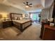 Spacious main bedroom boasts a tray ceiling, sitting area, and natural light at 1309 Bartlett Cir, Hillsborough, NC 27278