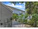Back exterior with light blue siding and backyard patio at 1344 Baez St, Raleigh, NC 27608