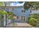 Light blue, multi-story home with backyard patio and sliding glass doors at 1344 Baez St, Raleigh, NC 27608