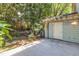 The backyard has a shed, patio, and lush trees at 1344 Baez St, Raleigh, NC 27608