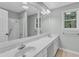 Bright bathroom with dual sinks, and updated lighting at 1344 Baez St, Raleigh, NC 27608