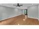 Large, light-filled bedroom with hardwood floors, ceiling fan, recessed lights, and French doors at 1344 Baez St, Raleigh, NC 27608