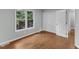 Newly painted bedroom with hardwood floors, a sunny window and a large closet at 1344 Baez St, Raleigh, NC 27608