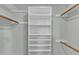 A bright empty closet features shelves and rods for hanging clothes at 1344 Baez St, Raleigh, NC 27608