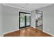 Dining area featuring hardwood floors, a modern light fixture, and access to the backyard at 1344 Baez St, Raleigh, NC 27608