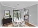 Dining area featuring a round table with chairs and an adjacent view of a stainless steel kitchen at 1344 Baez St, Raleigh, NC 27608